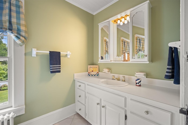 bathroom featuring vanity, radiator, ornamental molding, baseboards, and tile patterned floors