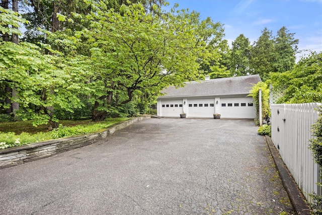 detached garage with fence