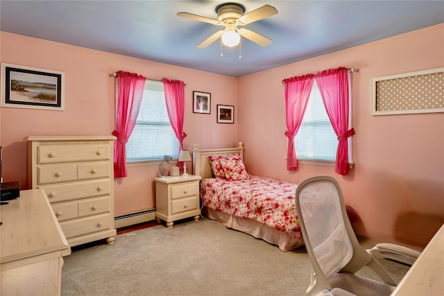 bedroom with baseboard heating, light carpet, and a ceiling fan