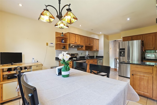 dining area featuring light tile patterned flooring and recessed lighting