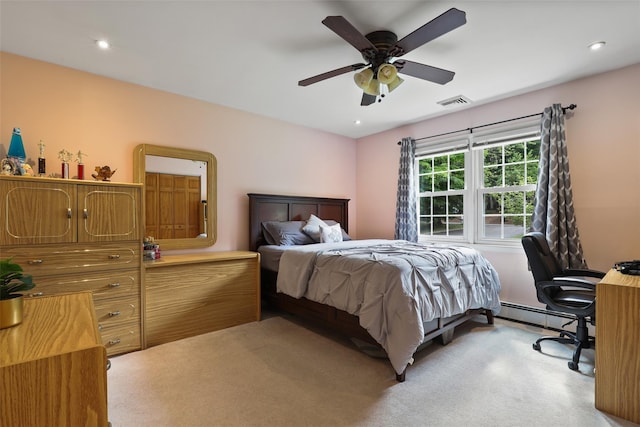 carpeted bedroom featuring recessed lighting, ceiling fan, visible vents, and a baseboard radiator