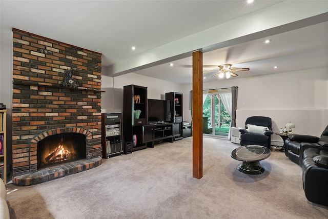 living room with recessed lighting, a baseboard radiator, a brick fireplace, and light carpet