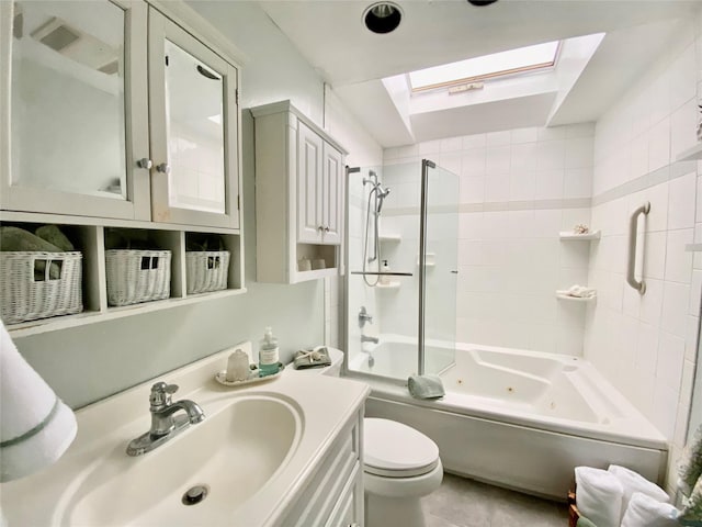 4081 Massachusetts Ave, Island Park, NY 11558 - full bath with toilet, vanity, a combined bath / shower with jetted tub, a skylight, and tile patterned flooring