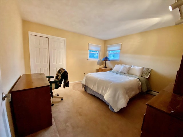 4081 Massachusetts Ave, Island Park, NY 11558 - carpeted bedroom with a baseboard radiator, baseboards, and a closet