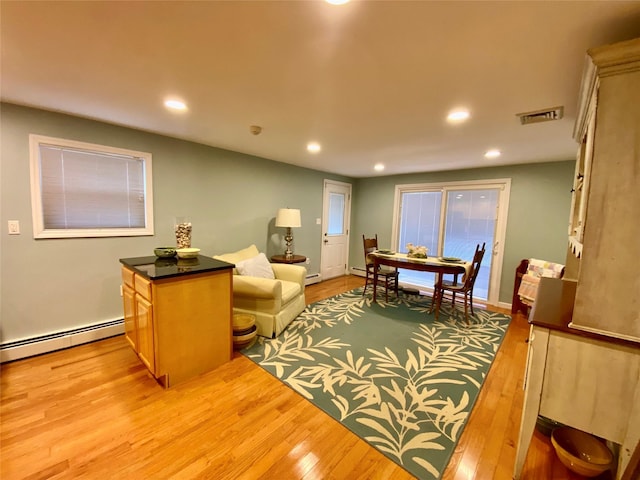 4081 Massachusetts Ave, Island Park, NY 11558 - living room featuring visible vents, recessed lighting, light wood-style floors, and baseboard heating