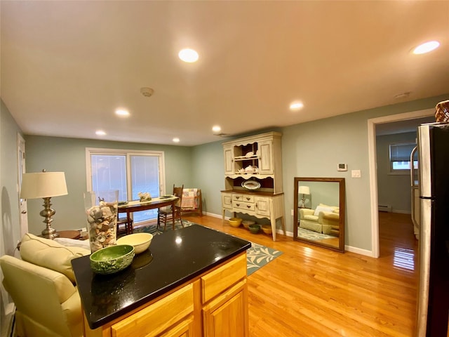 4081 Massachusetts Ave, Island Park, NY 11558 - kitchen featuring freestanding refrigerator, light wood-style flooring, baseboards, and recessed lighting