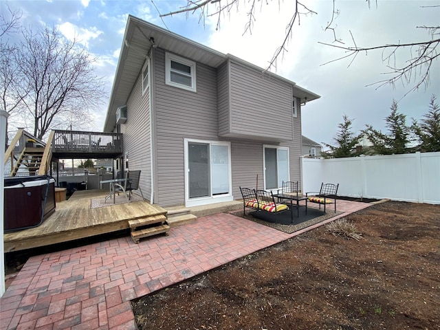 4081 Massachusetts Ave, Island Park, NY 11558 - rear view of house featuring a patio area, a deck, fence, and a hot tub