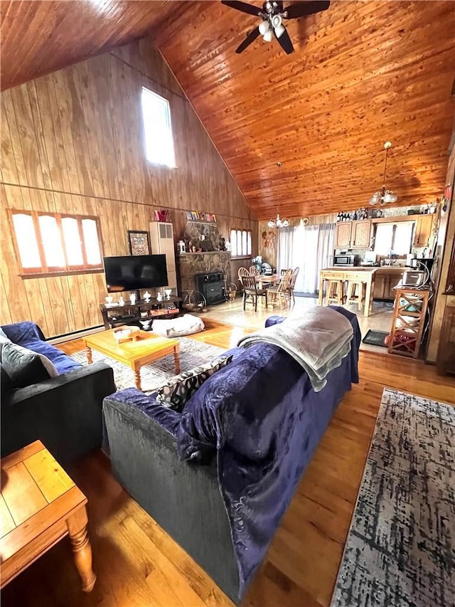 living room with high vaulted ceiling, wood finished floors, wood ceiling, and a ceiling fan