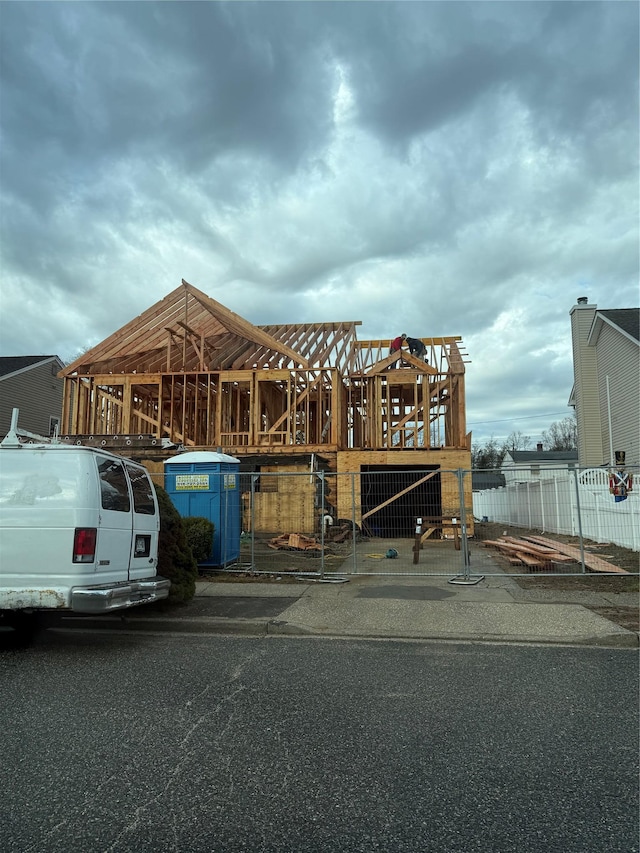 12 Mistletoe Ln, Levittown, NY 11756 - view of parking with fence and a gate