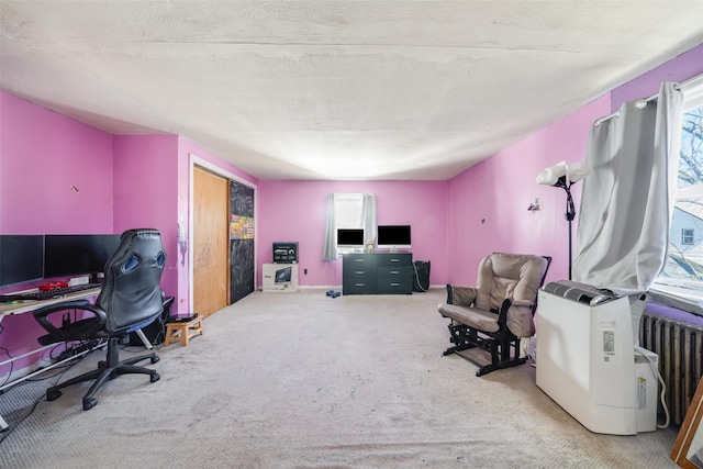 home office with carpet flooring and radiator heating unit