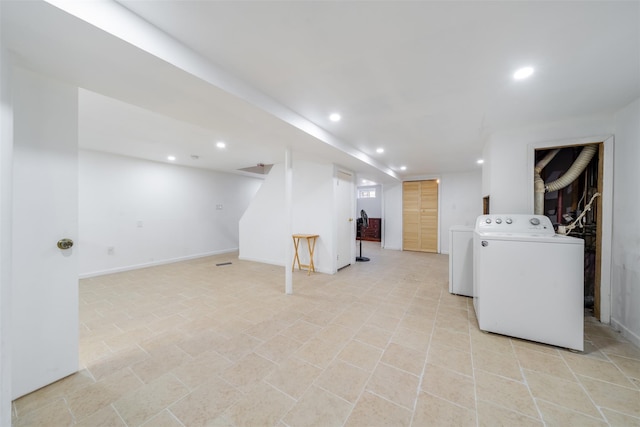 finished basement featuring baseboards and recessed lighting