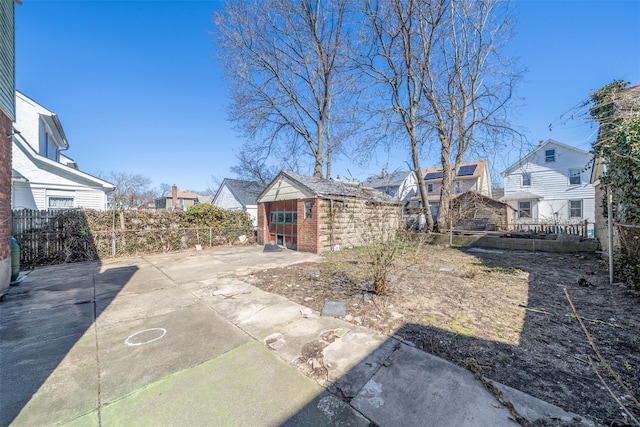 exterior space featuring a fenced backyard and a residential view