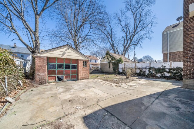 garage with fence