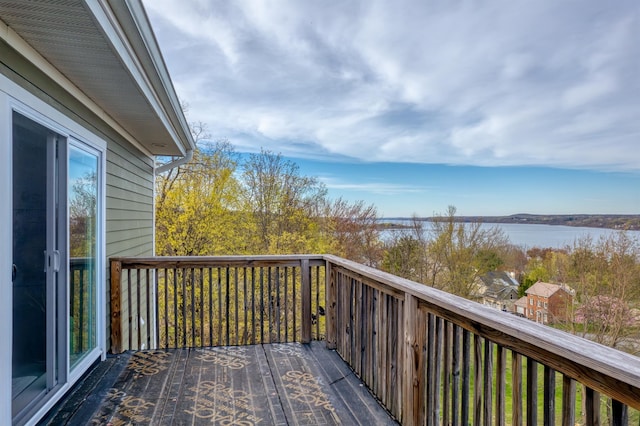 wooden deck featuring a water view