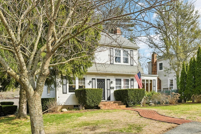 36 Seaview Ave, Northport, NY 11768 - view of front of home with a front yard, crawl space, and a chimney