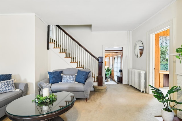 36 Seaview Ave, Northport, NY 11768 - entrance foyer with radiator, crown molding, carpet floors, and stairway