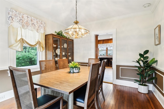 36 Seaview Ave, Northport, NY 11768 - dining room with ornamental molding, a notable chandelier, and wood-type flooring