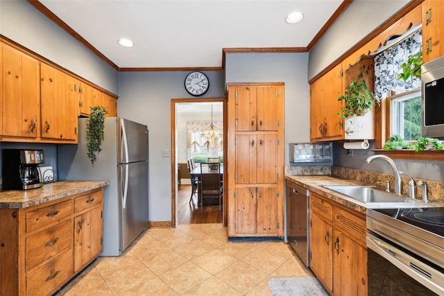36 Seaview Ave, Northport, NY 11768 - kitchen featuring a sink, crown molding, brown cabinets, and appliances with stainless steel finishes