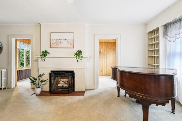 36 Seaview Ave, Northport, NY 11768 - sitting room featuring a brick fireplace, crown molding, carpet, and radiator