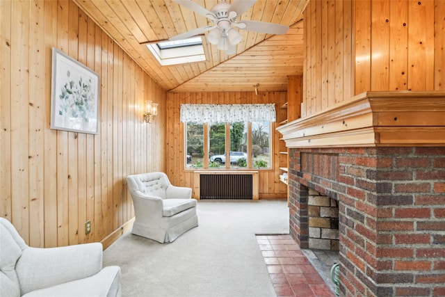 36 Seaview Ave, Northport, NY 11768 - sitting room featuring carpet flooring, a brick fireplace, wooden walls, and radiator