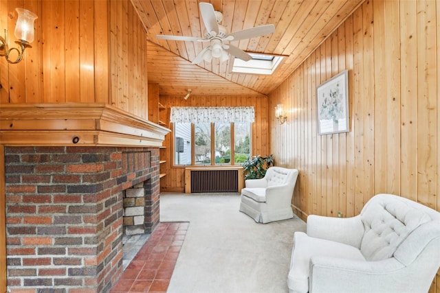 36 Seaview Ave, Northport, NY 11768 - sitting room with radiator, carpet flooring, wooden ceiling, wooden walls, and ceiling fan