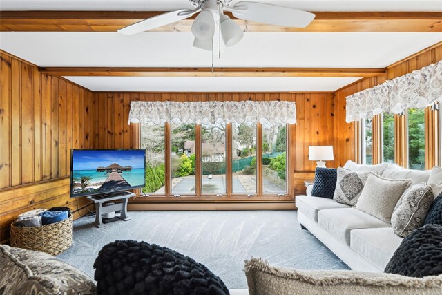 36 Seaview Ave, Northport, NY 11768 - carpeted living room with beam ceiling, ceiling fan, and a wealth of natural light