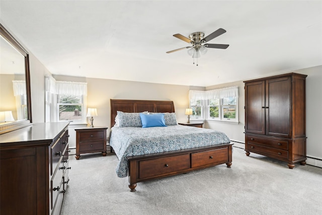 36 Seaview Ave, Northport, NY 11768 - bedroom featuring ceiling fan, a baseboard heating unit, and light carpet