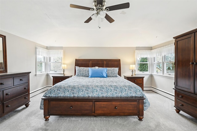 36 Seaview Ave, Northport, NY 11768 - bedroom featuring a baseboard heating unit, multiple windows, baseboard heating, and light colored carpet