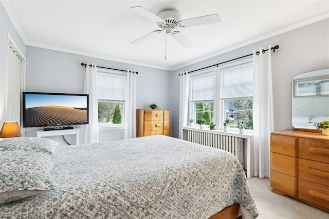 36 Seaview Ave, Northport, NY 11768 - bedroom with a ceiling fan, radiator, crown molding, and light carpet