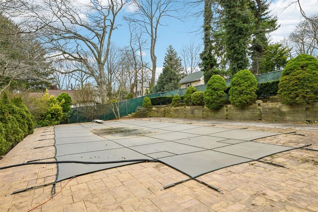 36 Seaview Ave, Northport, NY 11768 - view of swimming pool featuring a patio, fence, and a diving board