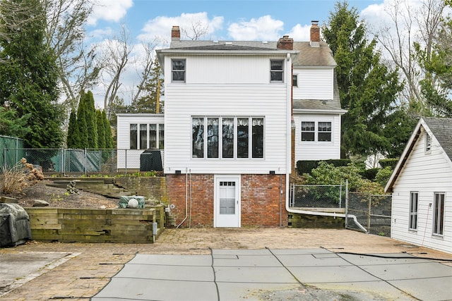 36 Seaview Ave, Northport, NY 11768 - back of house with a patio, a chimney, and fence
