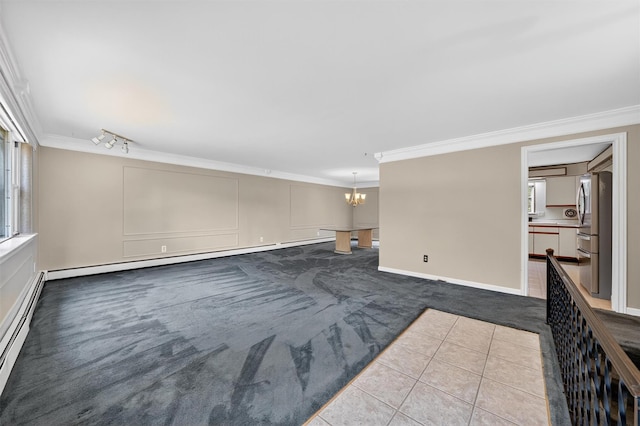 21 Hillside Rd, Slate Hill, NY 10973 - unfurnished living room with a chandelier, dark carpet, crown molding, healthy amount of natural light, and a baseboard radiator