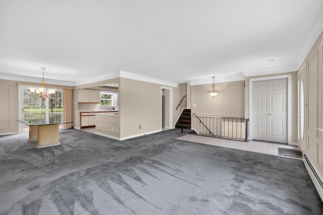 21 Hillside Rd, Slate Hill, NY 10973 - unfurnished living room with carpet flooring, a chandelier, ornamental molding, a baseboard heating unit, and stairs