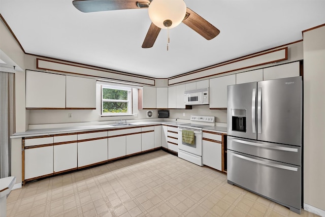 21 Hillside Rd, Slate Hill, NY 10973 - kitchen featuring white appliances, white cabinets, a ceiling fan, light flooring, and light countertops