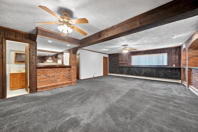 21 Hillside Rd, Slate Hill, NY 10973 - unfurnished living room with ceiling fan, a textured ceiling, carpet, brick wall, and wooden walls