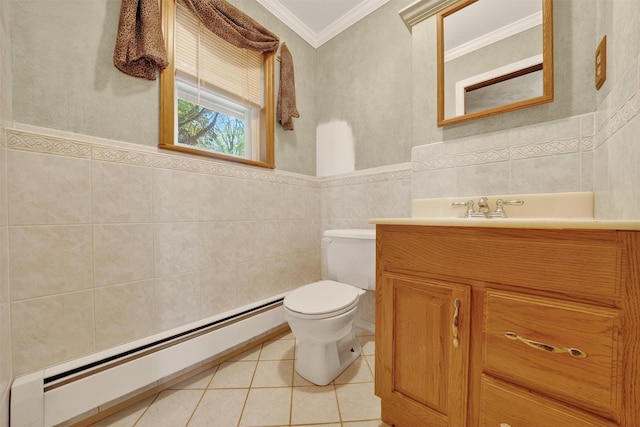 21 Hillside Rd, Slate Hill, NY 10973 - bathroom featuring baseboard heating, tile walls, crown molding, tile patterned floors, and vanity
