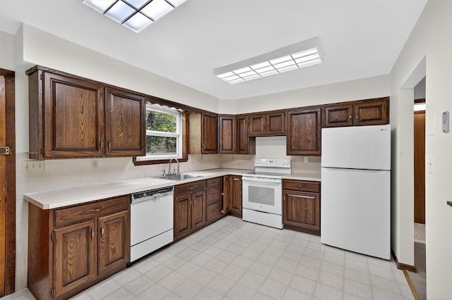 21 Hillside Rd, Slate Hill, NY 10973 - kitchen with white appliances, light countertops, and dark brown cabinets