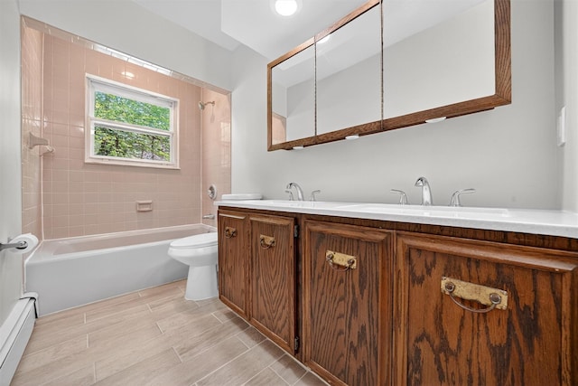 21 Hillside Rd, Slate Hill, NY 10973 - bathroom with a baseboard heating unit,  shower combination, double vanity, and wood finished floors