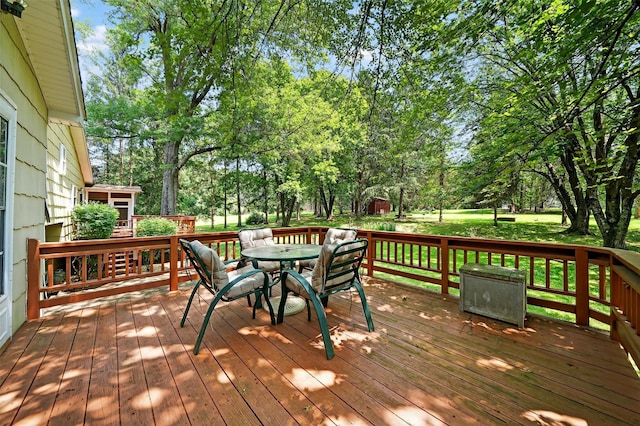 21 Hillside Rd, Slate Hill, NY 10973 - wooden terrace featuring view of wooded area and outdoor dining area