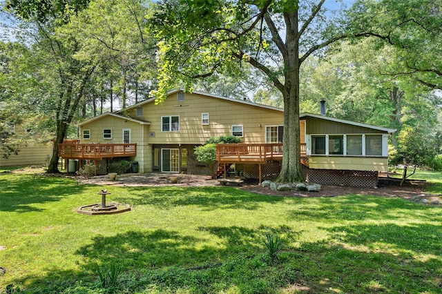21 Hillside Rd, Slate Hill, NY 10973 - rear view of property with a wooden deck, a sunroom, a yard, and a patio area