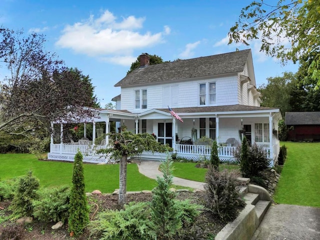 430 Montauk Hwy, East Moriches, NY 11940 - view of front of home with a front lawn, covered porch, and a chimney