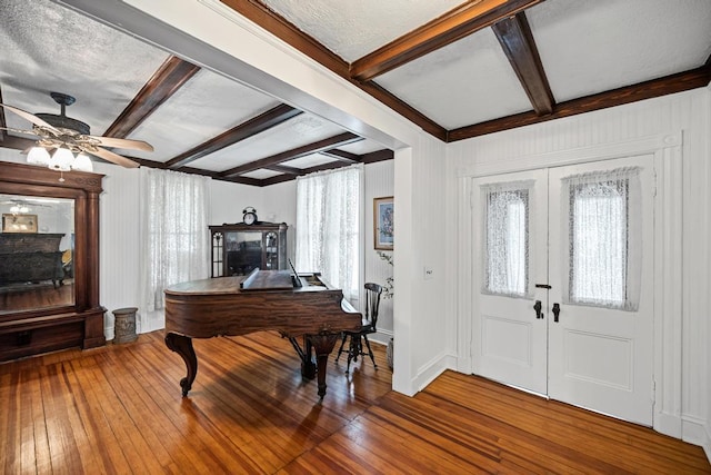430 Montauk Hwy, East Moriches, NY 11940 - foyer entrance featuring a fireplace, beam ceiling, and hardwood / wood-style flooring