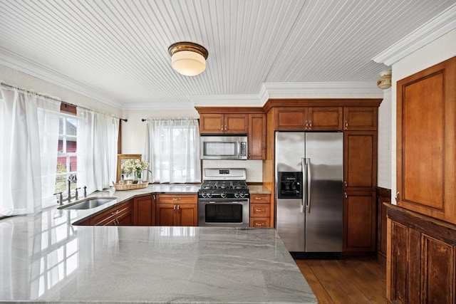 430 Montauk Hwy, East Moriches, NY 11940 - kitchen with a sink, ornamental molding, dark wood finished floors, stainless steel appliances, and light stone counters
