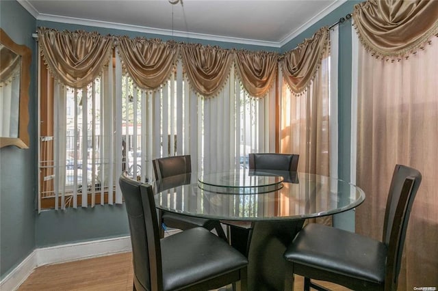 78-17 95th Ave, Ozone Park, NY 11416 - dining area with baseboards, ornamental molding, and wood finished floors