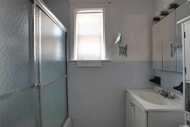 78-17 95th Ave, Ozone Park, NY 11416 - bathroom with tile walls and vanity