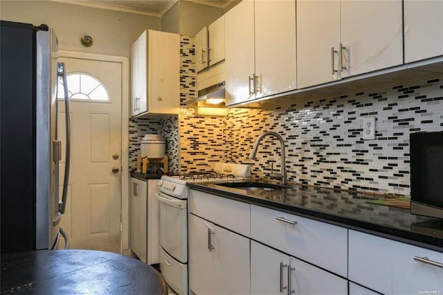 78-17 95th Ave, Ozone Park, NY 11416 - kitchen featuring freestanding refrigerator, backsplash, and dark countertops