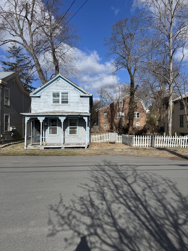 10 N Franklin St, Athens, NY 12015 - view of front of house with covered porch and fence