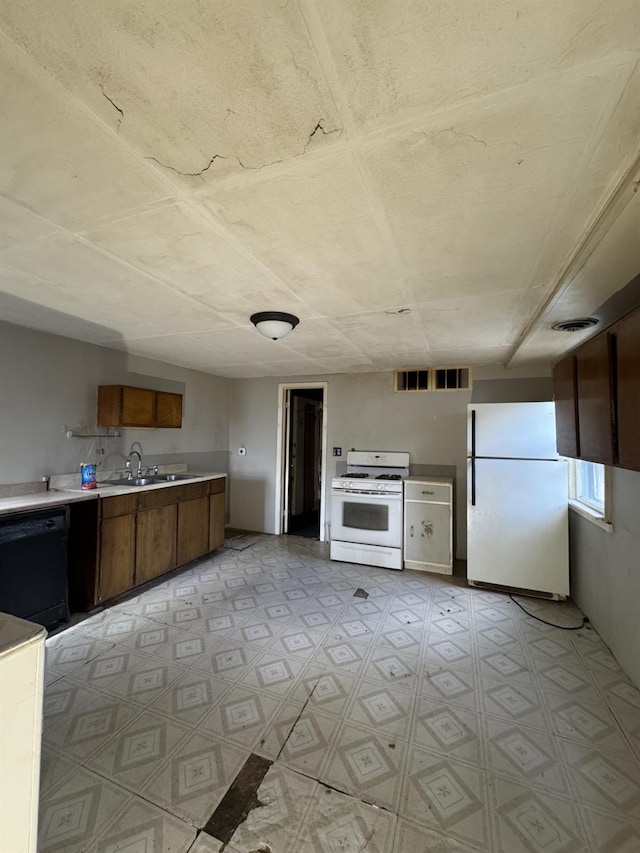 10 N Franklin St, Athens, NY 12015 - kitchen with light countertops, a sink, light floors, white appliances, and visible vents