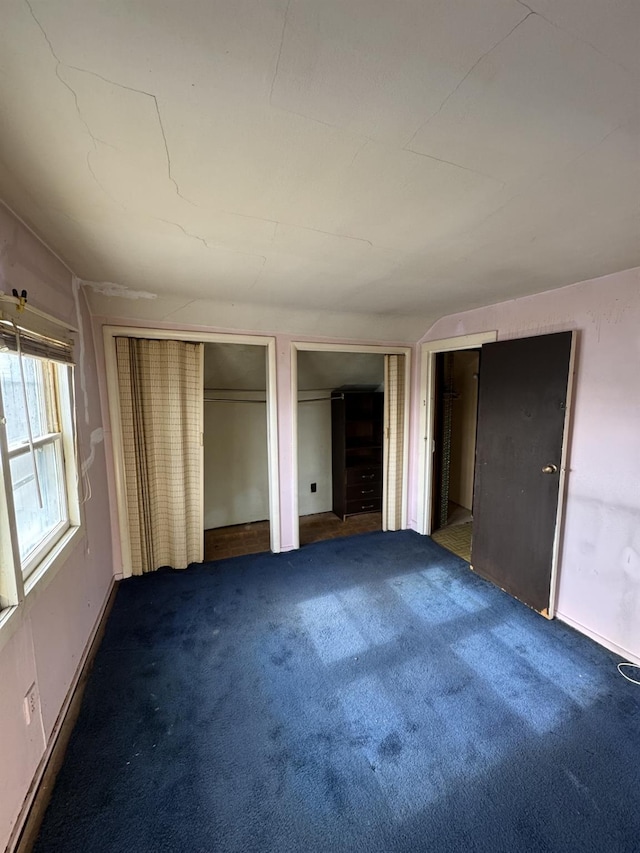 10 N Franklin St, Athens, NY 12015 - unfurnished bedroom featuring carpet and multiple closets