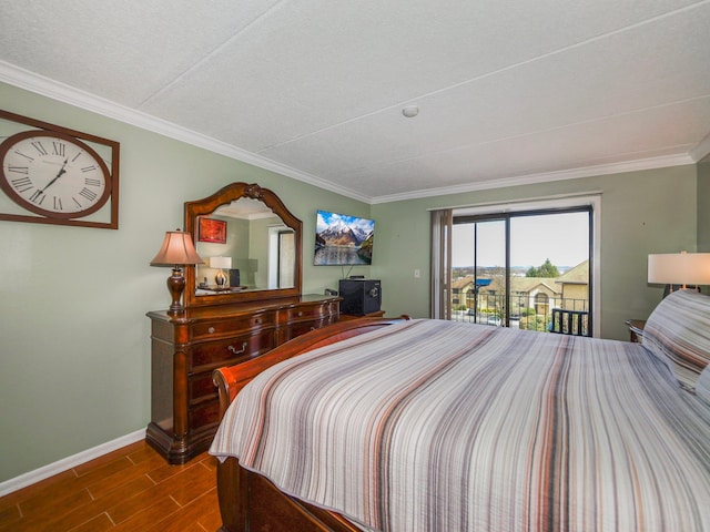 bedroom with access to outside, baseboards, ornamental molding, and wood finish floors